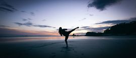 Franca Pastore High Kick on the Beach – Photo by Jason Briscoe @ Unsplash